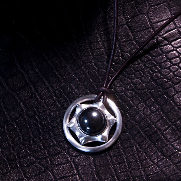 SIX POINT HEMATITE PENDANT ENCIRCLED WITH STERLING SILVER